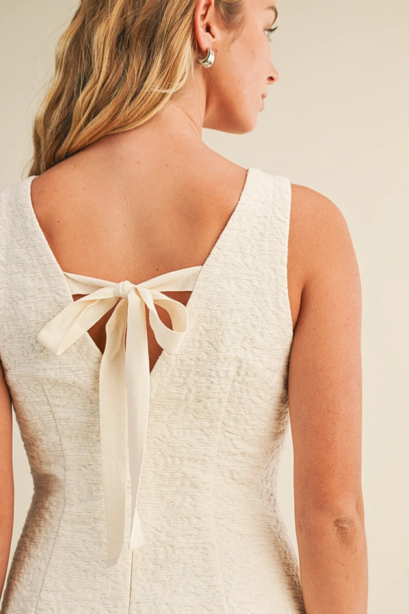 LETS CELEBRATE BACK V NECK TIE MINI DRESS - NATURAL